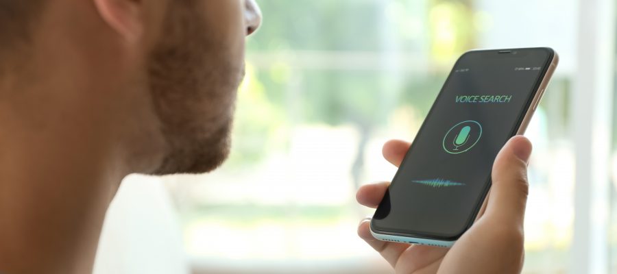 Young ,Man, Using, Voice, Search, On, Smartphone, Indoors, Closeup