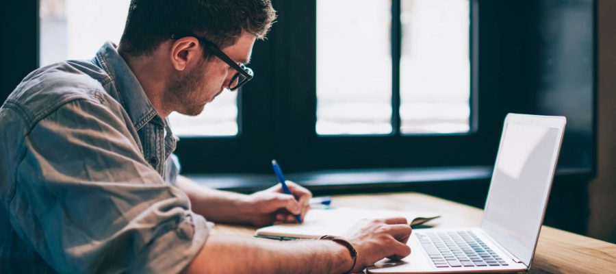 Business Man Working On White Paper For Website