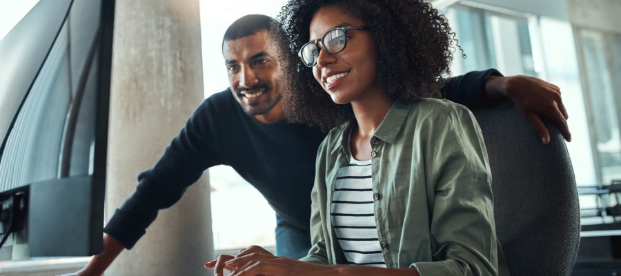 A Black Man & Black Woman Creating SEO Content At An Office In Dallas