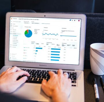 business owner reviewing performance max ads in Google Analytics 4